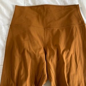 selling these mustard orange lulu leggings! no tag but size 6